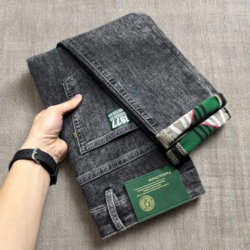 الاتجاه الأصلي الربيع والصيف رقيقة الرجال سليم المناسب مطاطا الراقية السراويل الجينز أقدام صغيرة جديد طويل العلامة التجارية الشارع الشهير السراويل