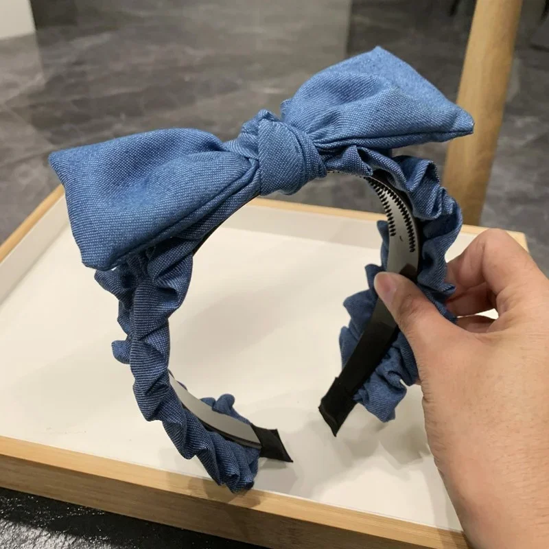 Copricapo da donna popolare Fasce per capelli dentate in tessuto denim arricciato Fasce per capelli annodate con fiocco superiore per le donne Indossa la testa per lo shopping casual