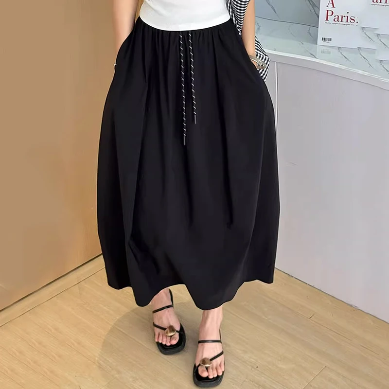 تنورة نسائية صيفية من الحرير الجليدي لعام 2025 بخصر مطاطي كوري تنانير طويلة على شكل حرف A للسيدات بأربطة ملابس خروج رفيعة تنانير نسائية