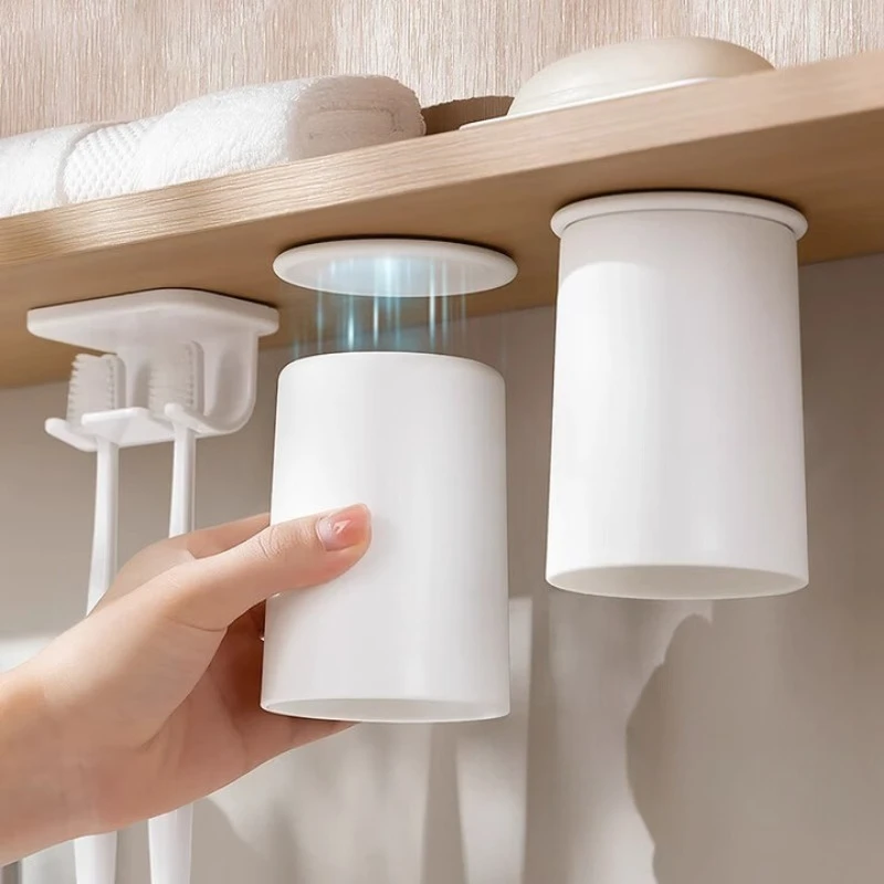 

Magnetic mouthwash cup under the mirror cabinet toothbrush cup family free punching family four-member cabinet bottom upside