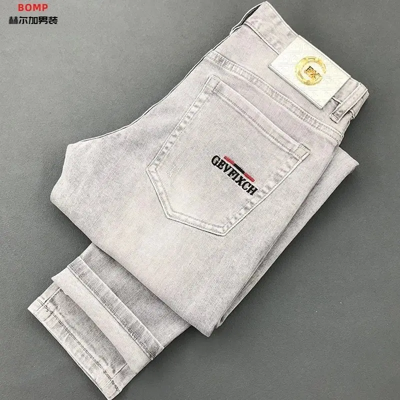 High-end 2026 Brand Printed Men's Jeans Spring and Autumn New Cargo Brand Workwear Slim Elastic Small Feet Casual Long Pants