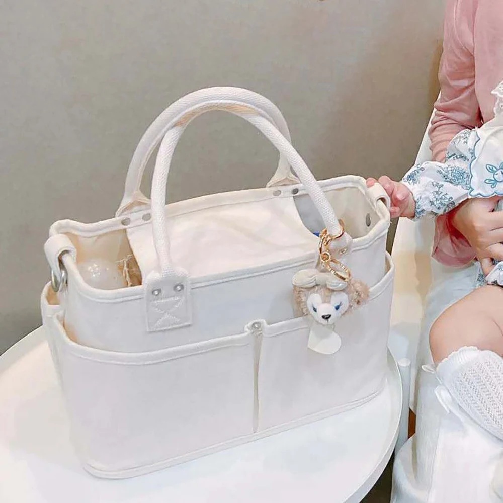 Diaper Bag Minimalist Beige Design Dual Carry Handheld Spacious Pocket Lightweight Durable For Mom Baby Care Travel Diaper Bag