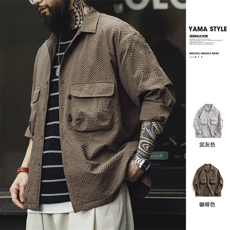 

2024 New Summer and Autumn Outdoor Cuban Collar Bubble Yarn Long Sleeve Shirt Non Ironing and Wrinkle Resistant Pocket Thin Shi