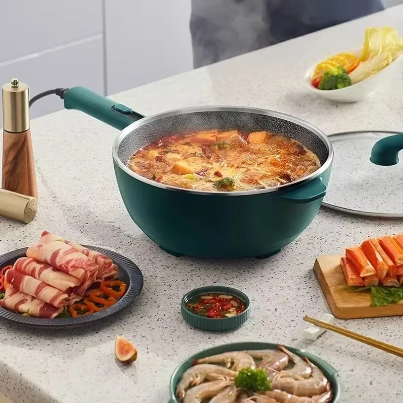 Electric frying pan an all-in-one household multi function pan for cooking frying steaming and cooking with high fire. Non stick