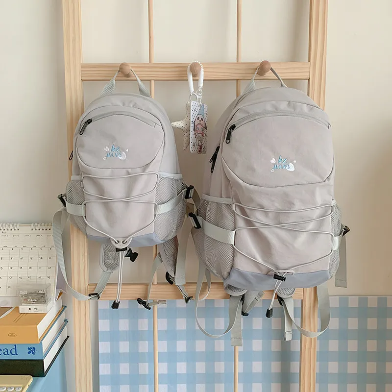 Korean-style fresh and simple backpack for middle and high school girls, casual and lightweight large-capacity backpack for coll