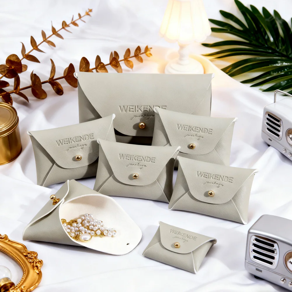 الجملة 50 قطعة 10x7 سنتيمتر الفاخرة بولي Leather الجلود الغبار المألوف كيس التخزين للمجوهرات شعار مخصص هدية صغيرة التفاف للقرط #1