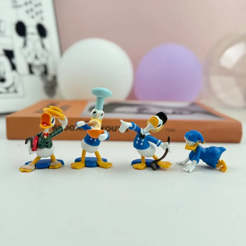 

Disney Donald Duck 4pcs Action Figures Set PVC Collectible Toys Classic Chef Pajama Gentleman Styles Desk Deco Collectibles