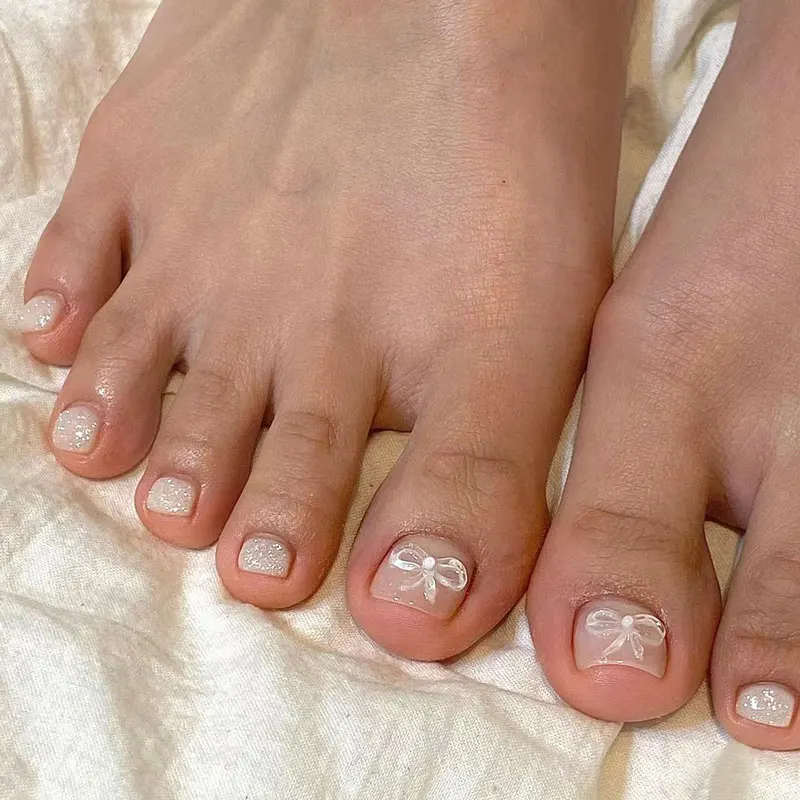 

24pcs/box wearable simple silver glitter fake toenails white three-dimensional bow foot manicure fake nails