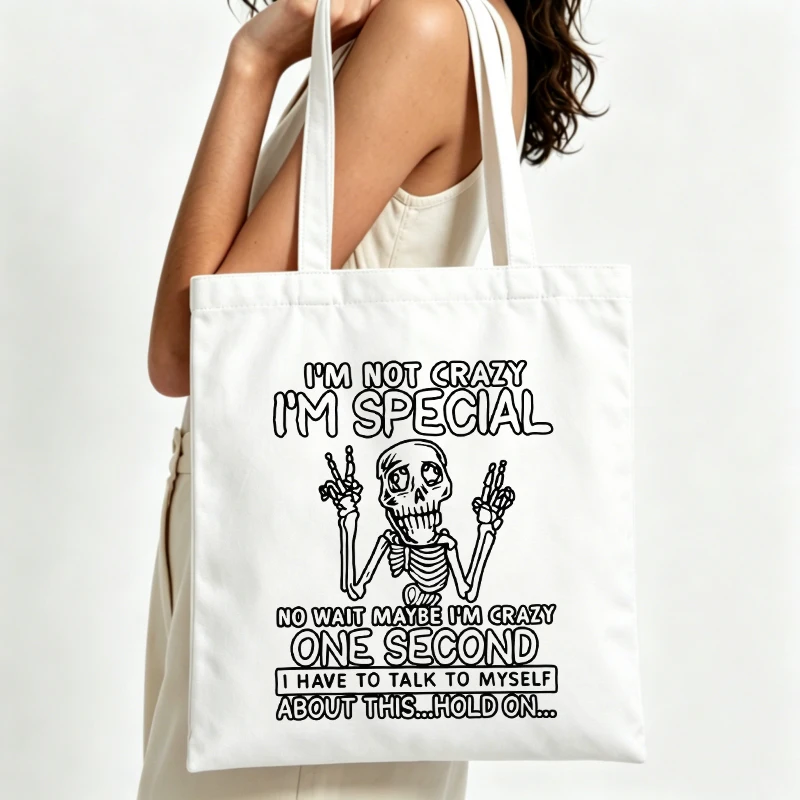 Women's skull graphic canvas tote bag with slogan print, perfect for casual daily use and street-style outings