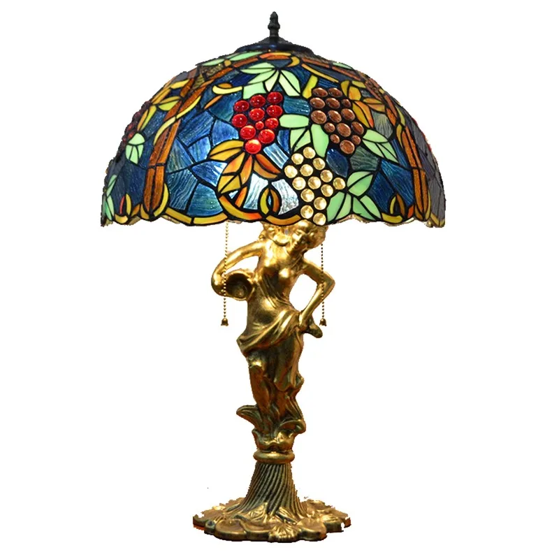 

Retro living room sofa next to decorative stained glass art decoration inlaid welding high-end character desk lamp