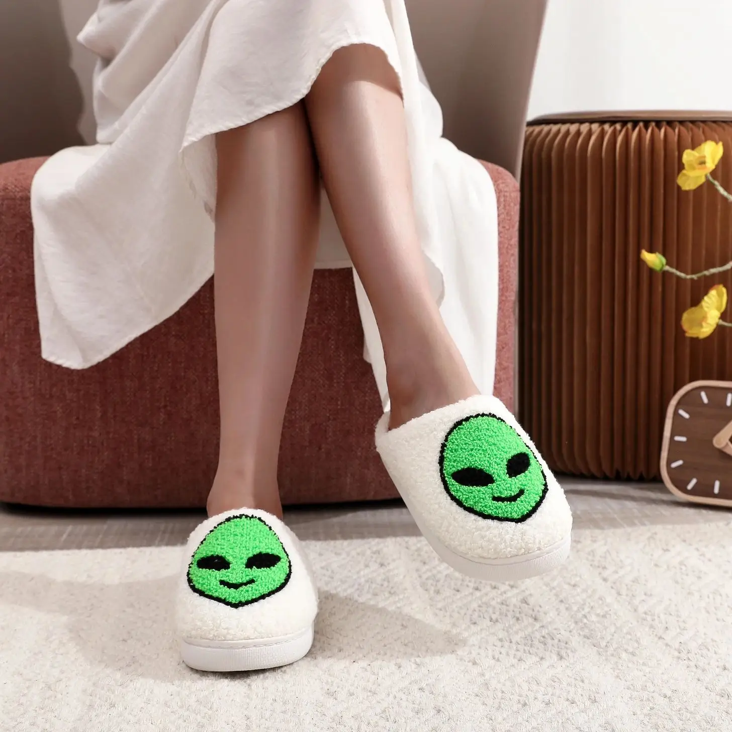 A pair of alien patterned winter home cotton slippers non-slip thick-soled wool slippers comfortable indoor shoes for men and women can wear