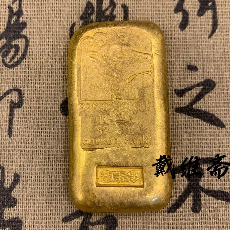 Wenwan ingot old item Hong Kong one or two nuggets ingot copper gilt lion head gold cake