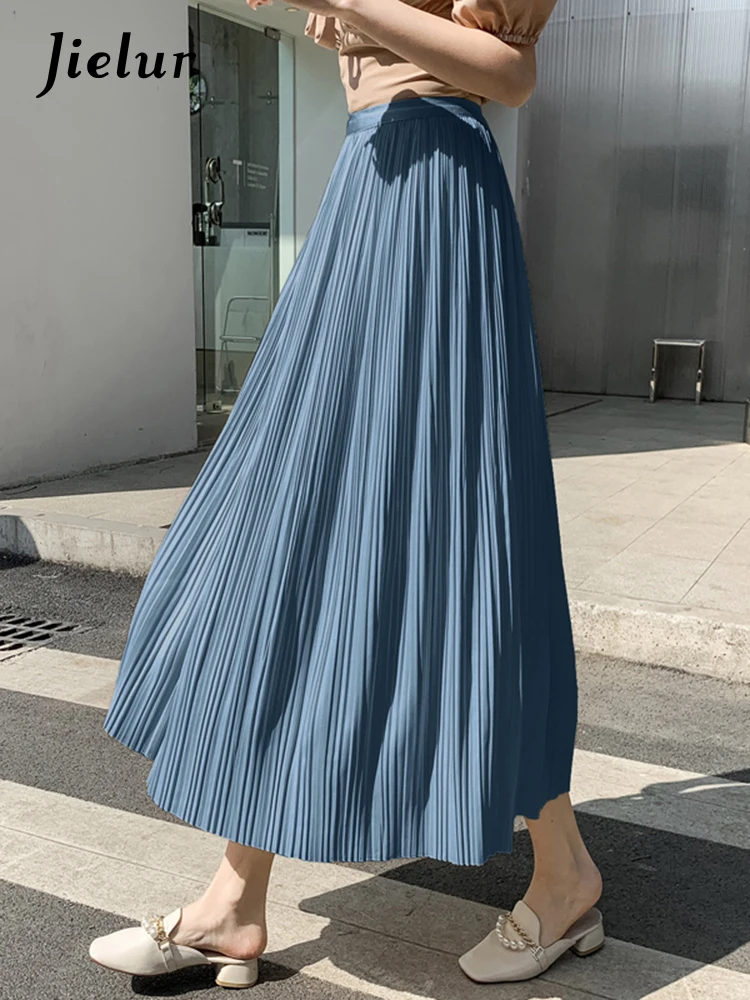 

Jielur Simple High-waist Chic Pleated Skirts Women Solid Color College A-line Skirt Female Fashion Office Lady Casual Midi Skirt