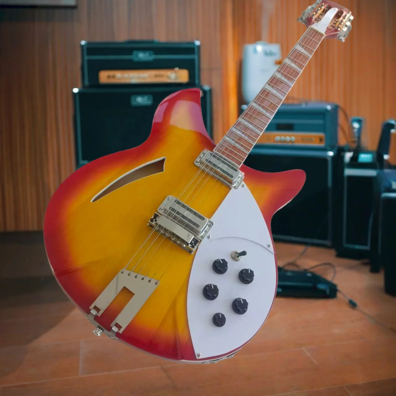 Semi-Hollow Electric Guitar in Red-Orange Sunburst Finish – Featuring A Signature Slender F-Hole on The Upper Left Bout