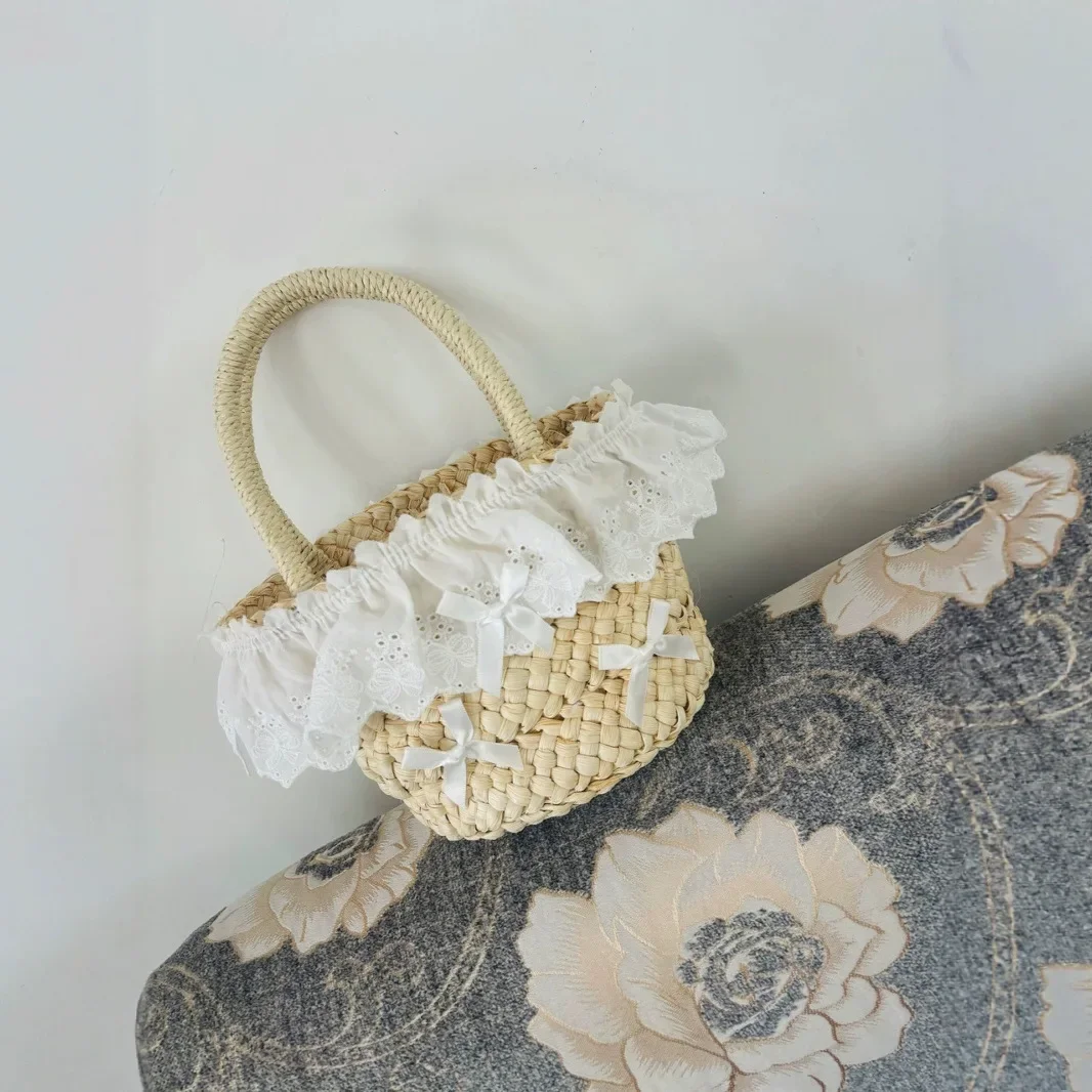 Niedliche Mini-Schleifen-Stroh-Eimertaschen für Frauen, Sommer-Spitzen-Strohtasche, handgefertigte gewebte Handtaschen und Geldbörsen, böhmische Strandtasche, Tragetasche, NEU