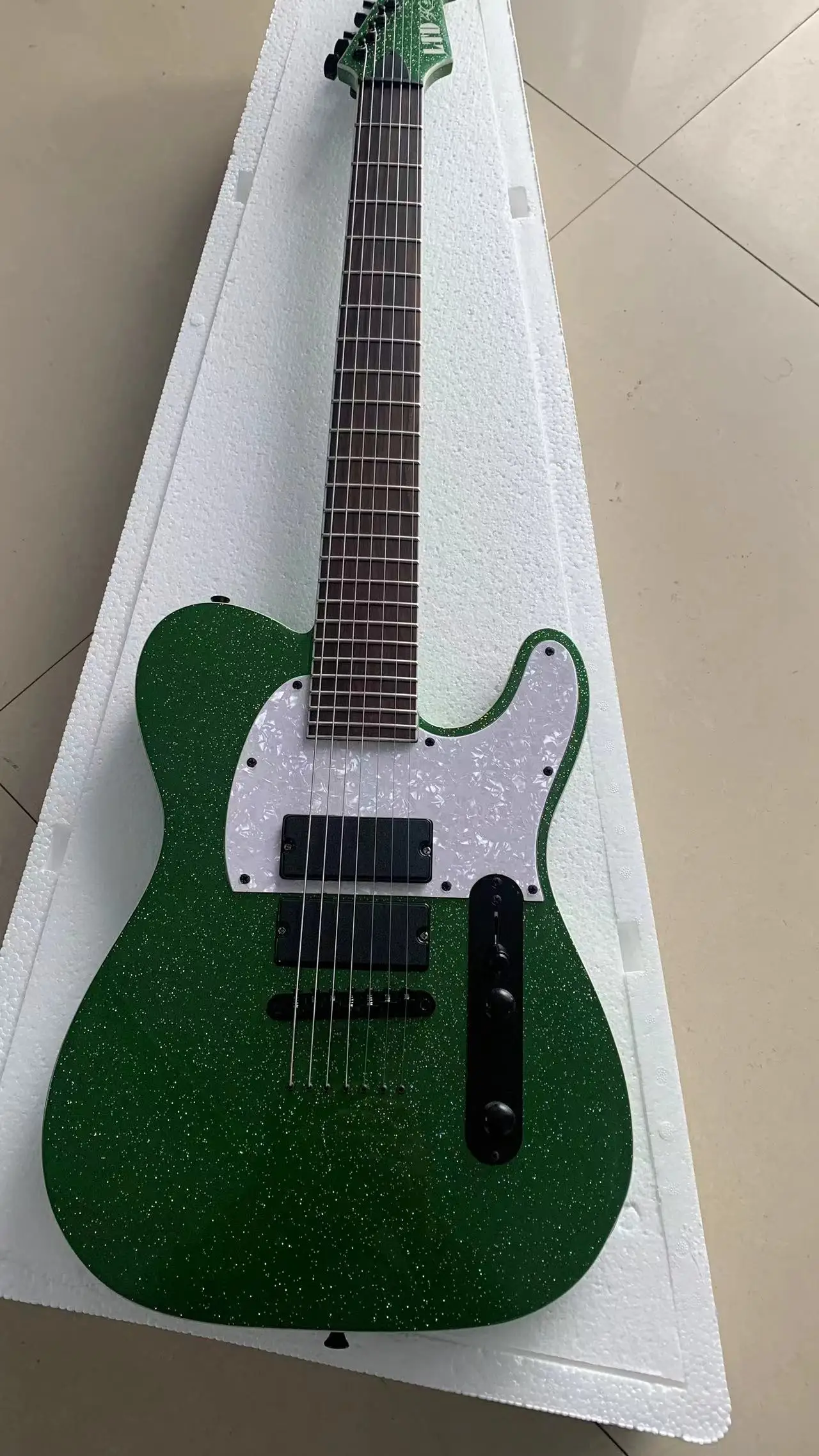 Factory manufacturing high-grade 7 string electric guitar, large particle 7 color sequin green, free mail