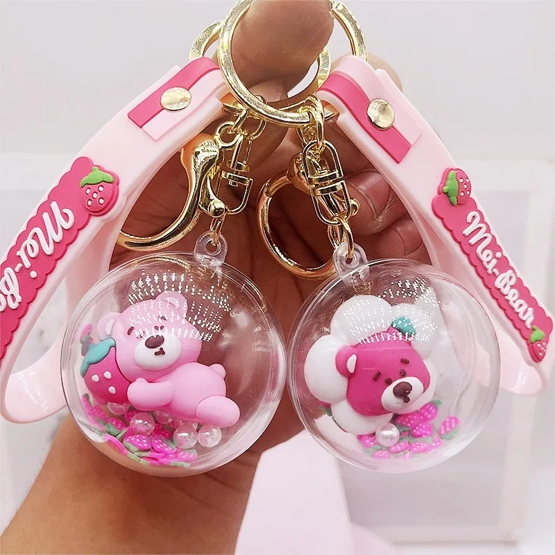 Creative cartoon walking baby strawberry bear rocking ball key chain, couple cute car key chain schoolbag pendant gift.