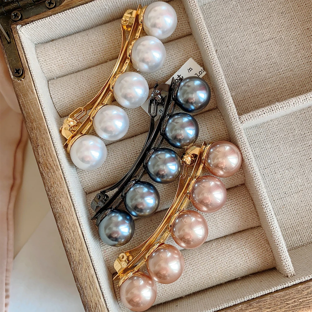 

Simple Elegant Pearl Low Horsetail Temperament Spring Clip Back Head Spoon Hair Clip Grasp Clip for women's