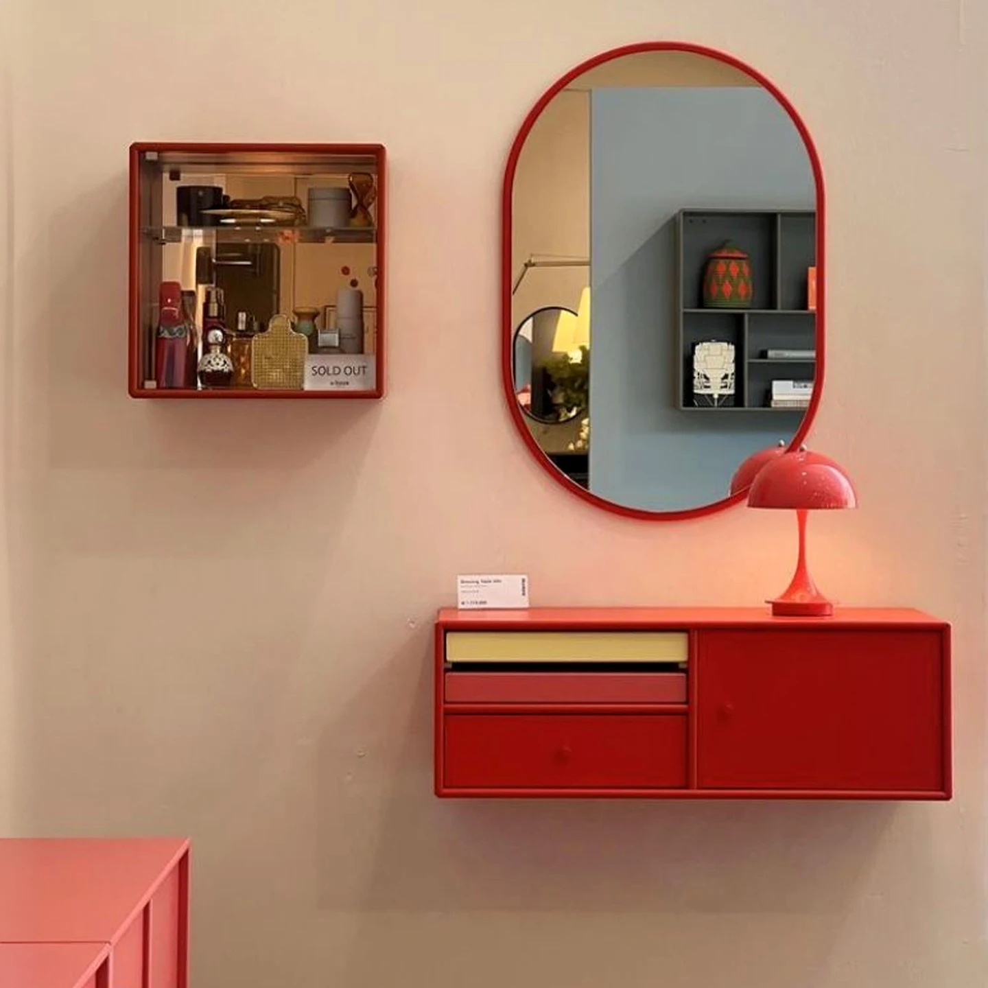 Oval Pebble Wall Mirror with Slim Red Frame product image