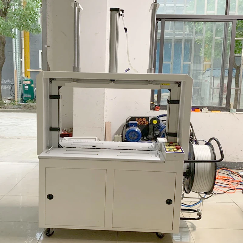 Automatic Top Press Coating Strapping Machine PP Band Strapping Packaging Machine For Clothing Custom & Bulk Order