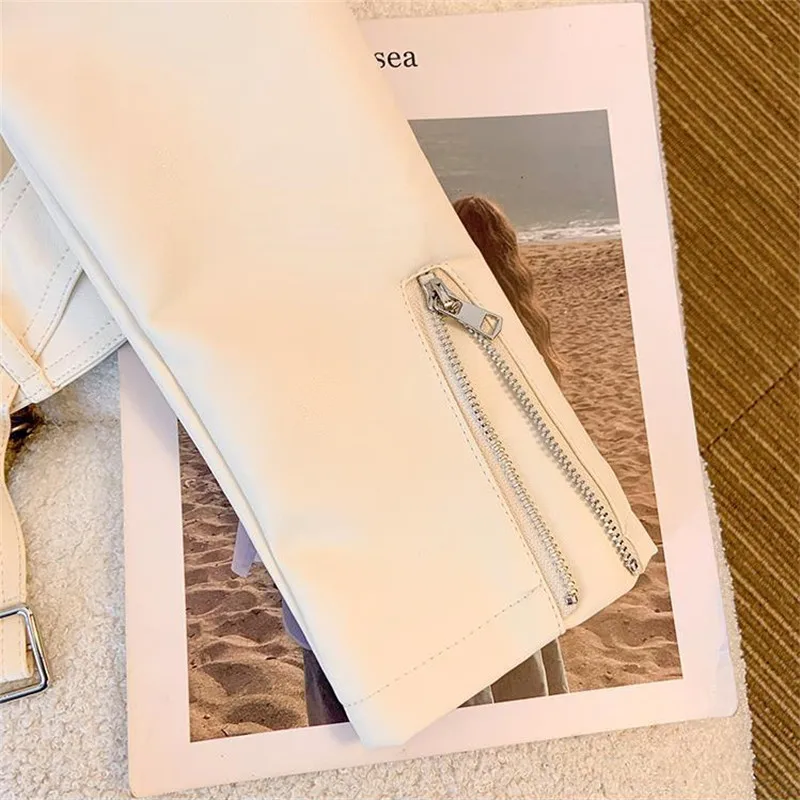 แจ็คเก็ตหนังสั้นแบบใหม่สำหรับฤดูใบไม้ผลิและฤดูใบไม้ร่วงปี 2026 สำหรับผู้หญิง ซิปต่อผ้าคาดเอว สไตล์มอเตอร์ไซค์ ปกเสื้อแบบปกเสื้อคลุมหนัง PU เสื้อลำลองสำหรับผู้หญิง รุ่น B1381