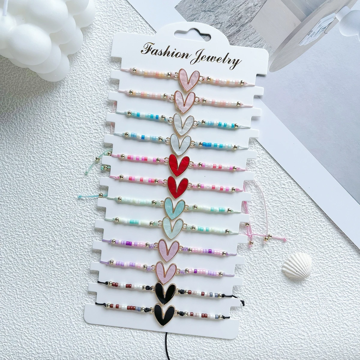 Juego de 12 piezas de pulsera de aleación de corazón más vendida, cuentas de arroz multicolores, pulsera de amistad ajustable para hombres y mujeres