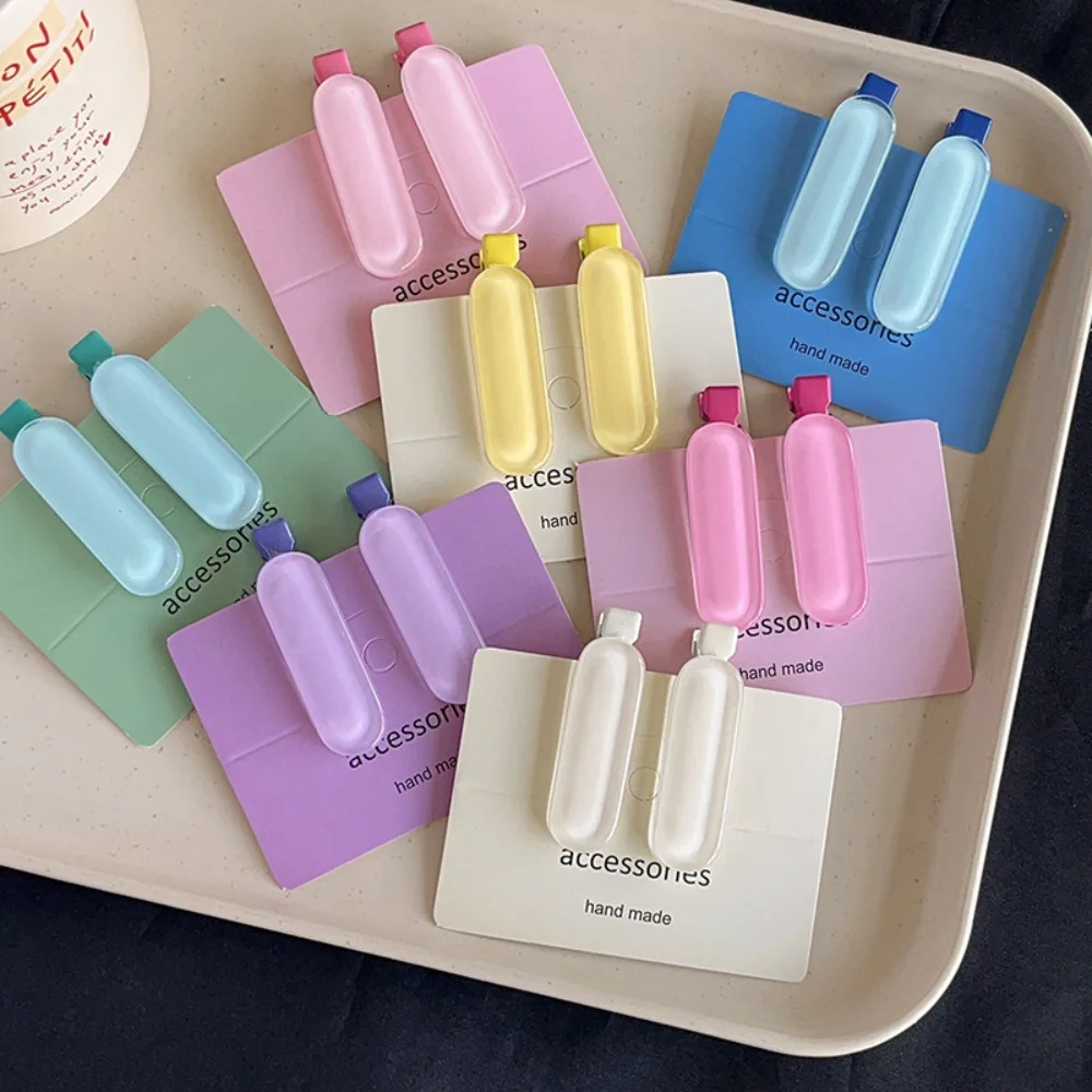 ที่หนีบผมรูปวงรีแฟชั่น2ชิ้น/เซ็ตกิ๊ฟหนีบผมหมวกสีเจลลี่ขนาดเล็กของขวัญคลิปด้านข้างทรงเรขาคณิต