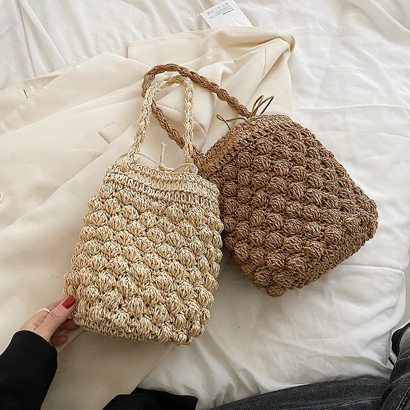 Straw Woven Bag 2022 New Bag Women's Beach Vacation Woven Bucket Bag Hollow Net Red Shoulder Messenger Bag Wholesale