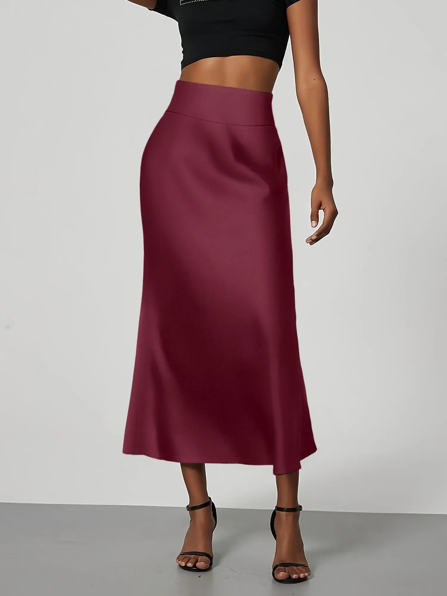 تنورة متوسطة الطول بحورية البحر بلون موحد، مصنوعة من نسيج ناعم ومقاوم للتجاعيد. أسلوب متوسط الطول يسطح الشكل، مما يجعلها