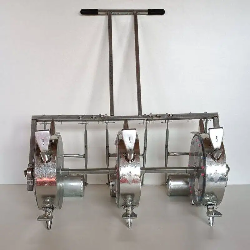 

Three lines and two lines of bean vegetable medicinal materials multi-functional hand push acupoint seeding machine