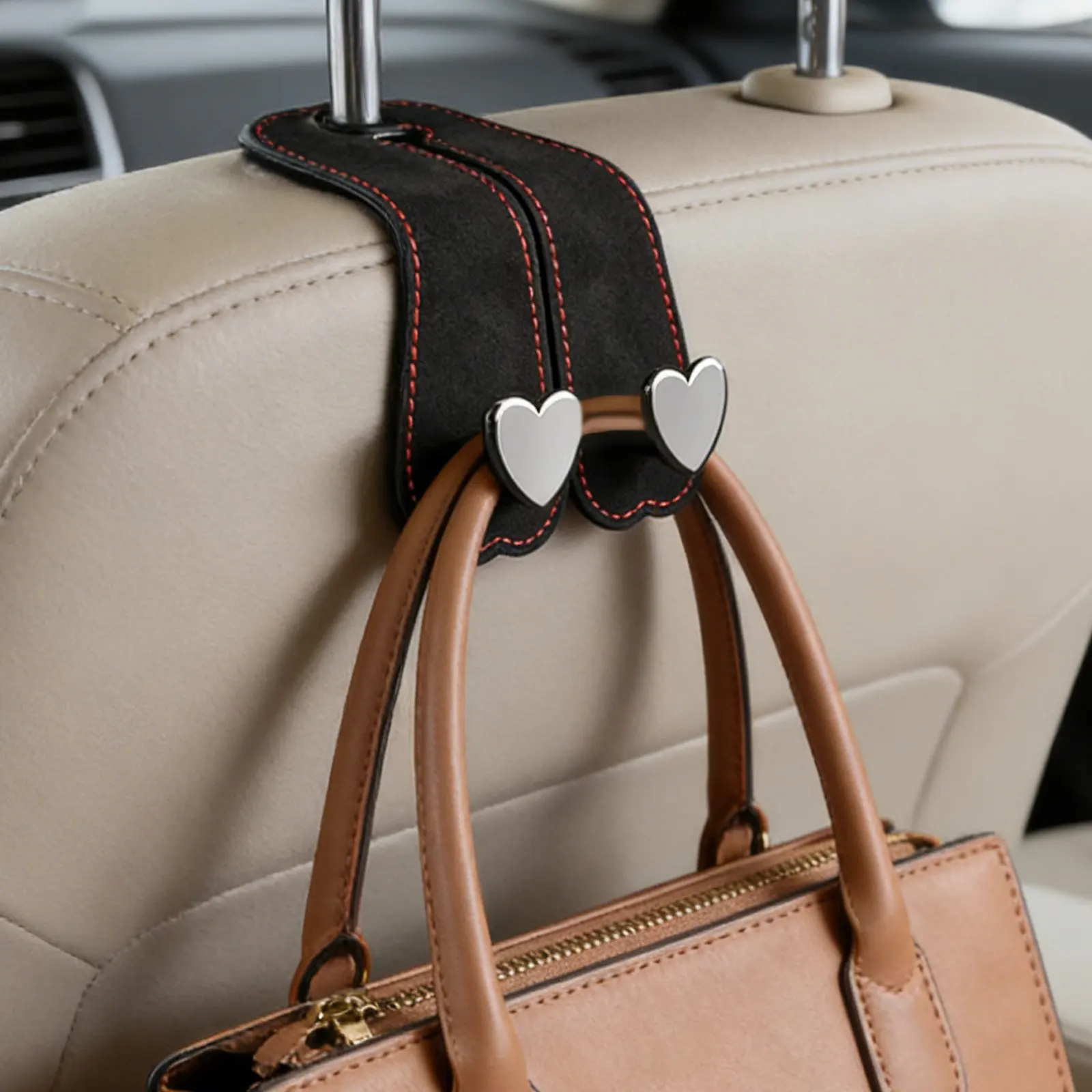 2 ganchos dobles para el respaldo del asiento del coche, hechos de ante sintético, con un diseño resistente, ideales para organizar bolsos y bolsas de la compra en el reposacabezas del coche. Color negro.