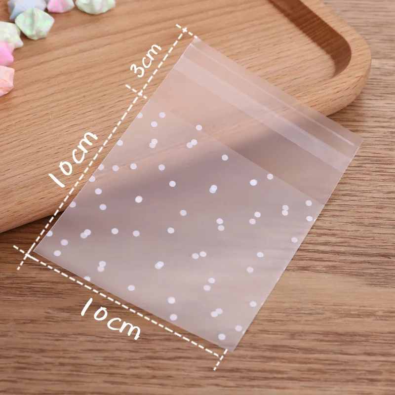 100Pcs พลาสติกใส Cellophane Candy Self กาวสีขาว Polka Dot Candy คุกกี้ของขวัญถุงสำหรับงานแต่งงานวันเกิด