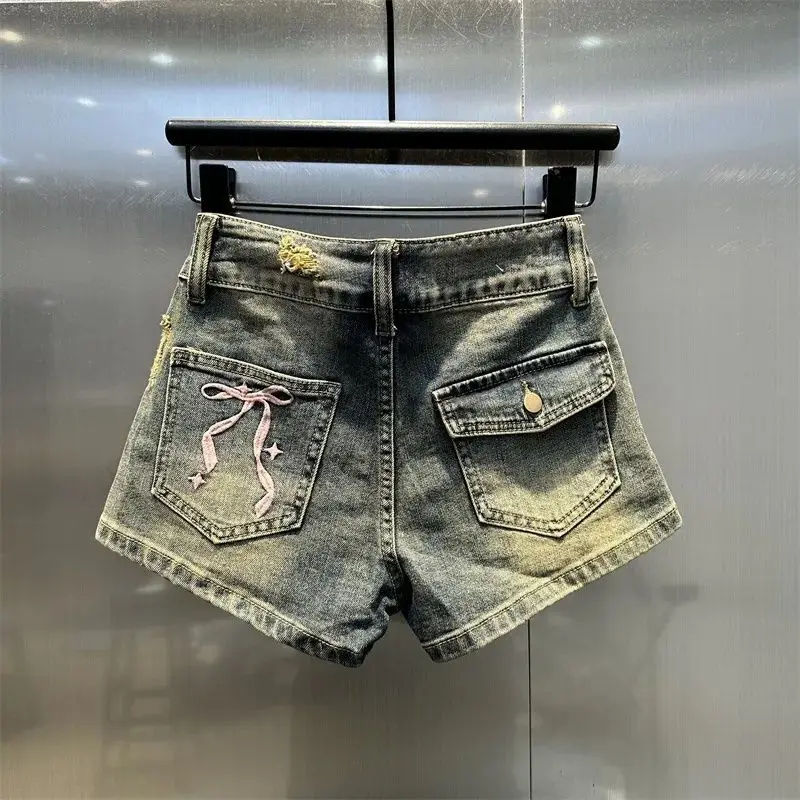Pantalones cortos de mezclilla con diseño deshilachado Sexy Retro, pantalones cortos de moda bordados con lazo de cintura baja para mujer