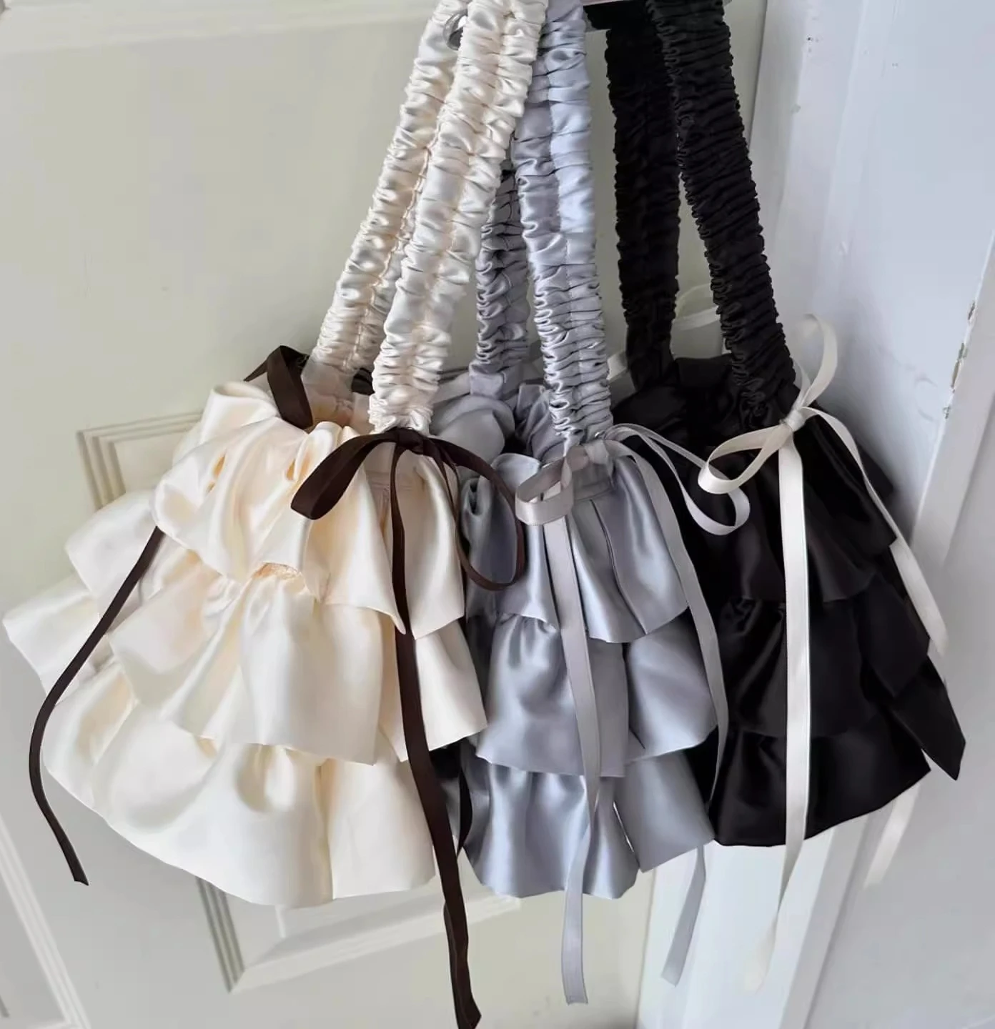 

2025 New Japanese Sweet Bow Ribbon Satin Women's Bags Lolita Ruffled Cake Skirt Styling Handbag Shoulder Messenger Bag female