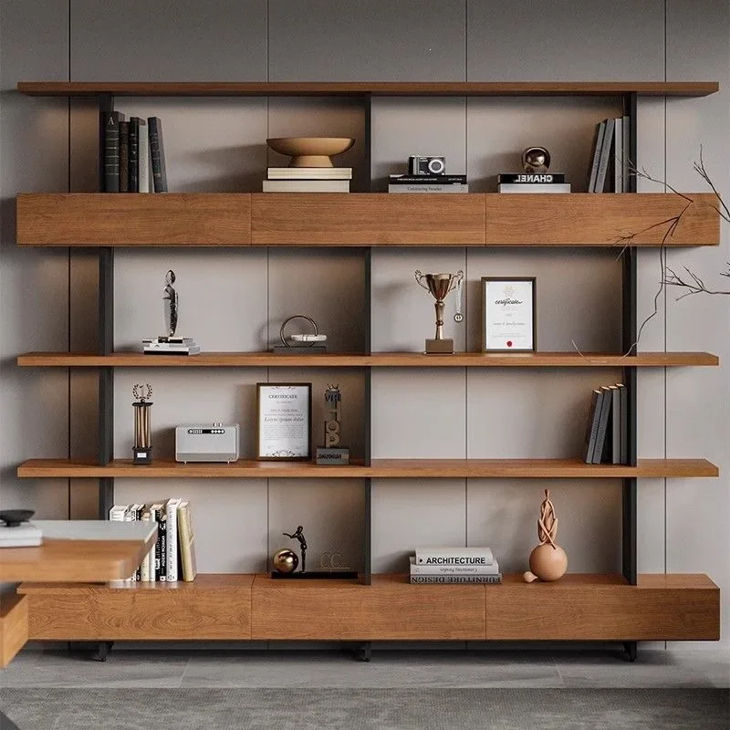 Bookshelf shelves are floor-to-ceiling, multi-level display and reading, all set against the wall