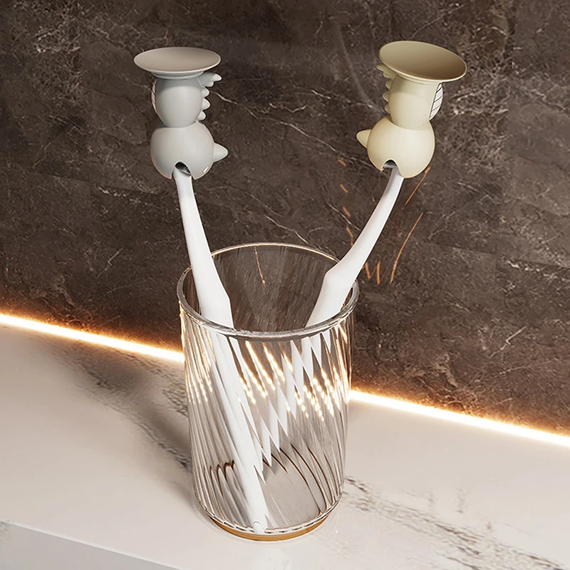 HUA ฝาครอบแปรงฟันหมวกขาตั้งน่ารักยืนแบบพกพาหัวแปรงสีฟันน่ารักไดโนเสาร์รูปร่างซิลิโคนดูดถ้วย