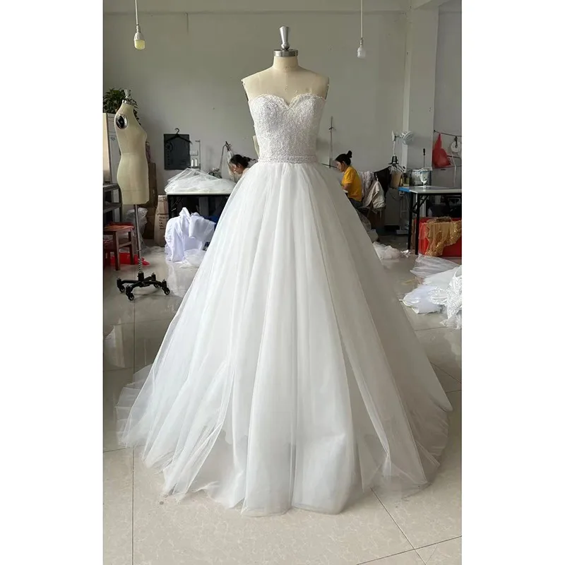 

Maria Novia Strapless Belted Wedding Dresses Sleeveless Lace Sweep Brush Train Lace Up Back Ball Gown Wedding Dress Customized