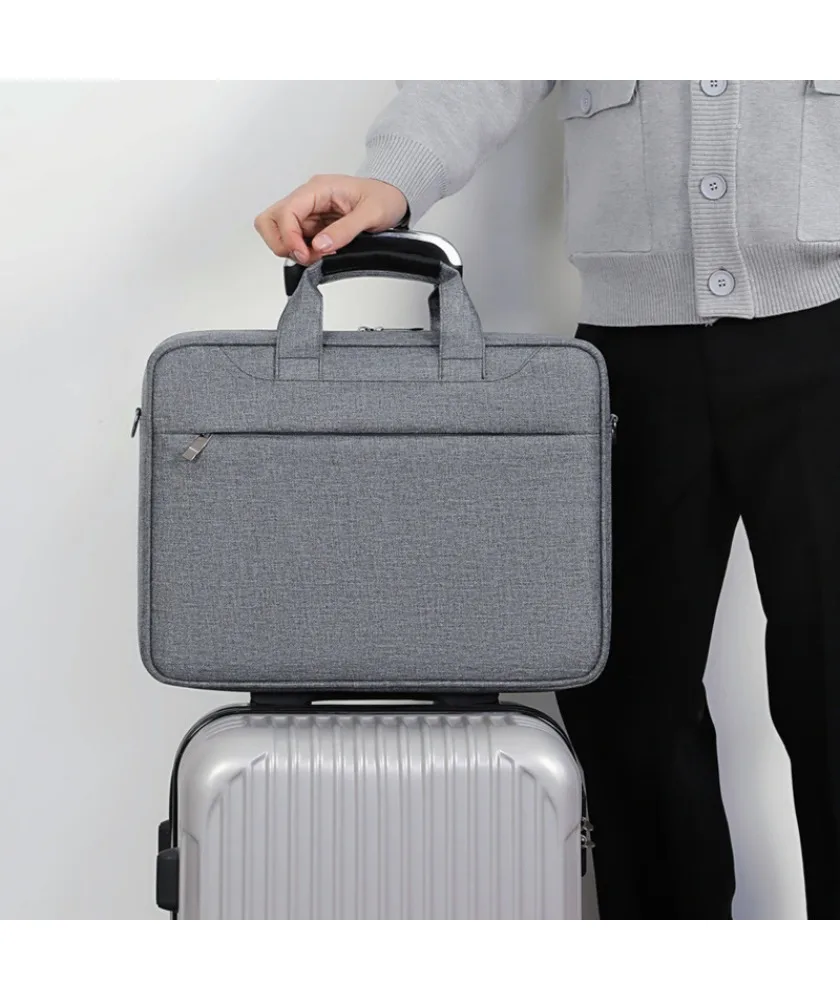 Navy blue canvas laptop bag with padded handle front slip pocket slim design water resistant material for work school