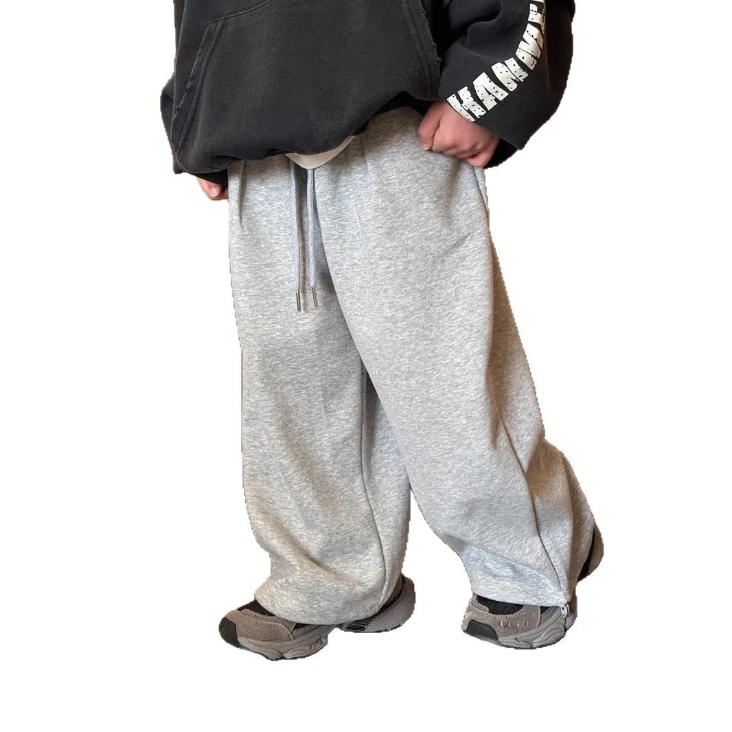 ملابس أطفال للأولاد سراويل تقليدية لربيع وصيف 2025 عصرية جديدة بلون سادة بسيطة للأطفال سراويل فضفاضة بسيطة بطول كامل