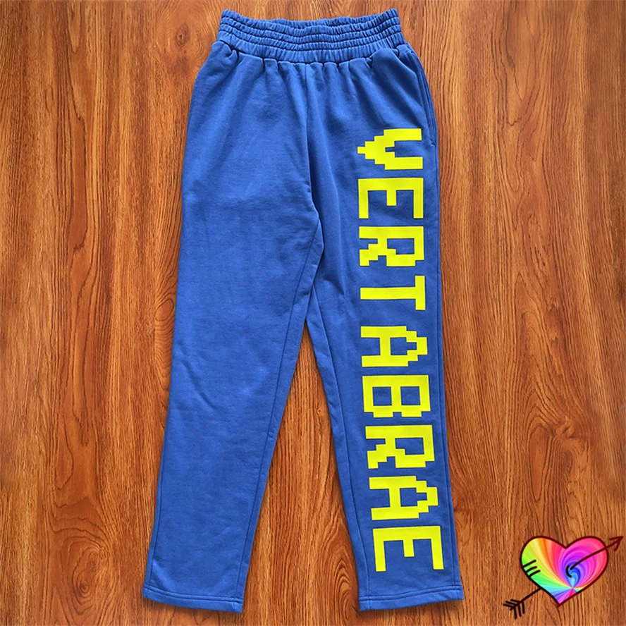 

Blue Puff Print Vertabrae Sweatpants Men Women 3D Yellow Vertabrae Logo Pants High Quality Jogger Trousers