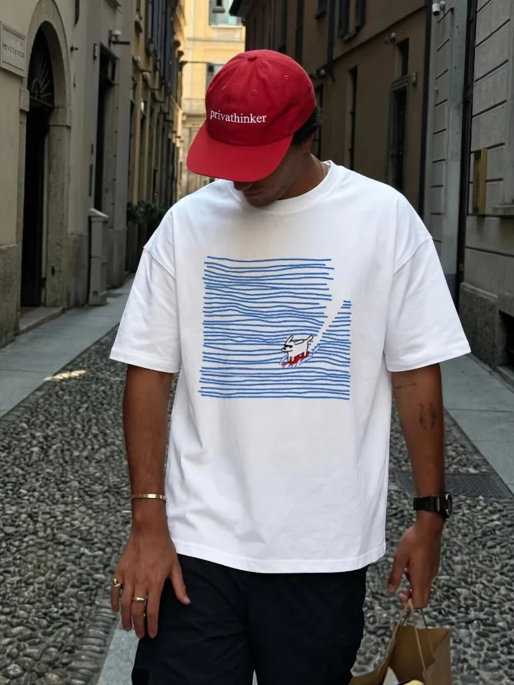 Nueva camisa informal de algodón de manga corta, con un estampado moderno y adorable de olas y perros surfistas, para hombre y mujer.