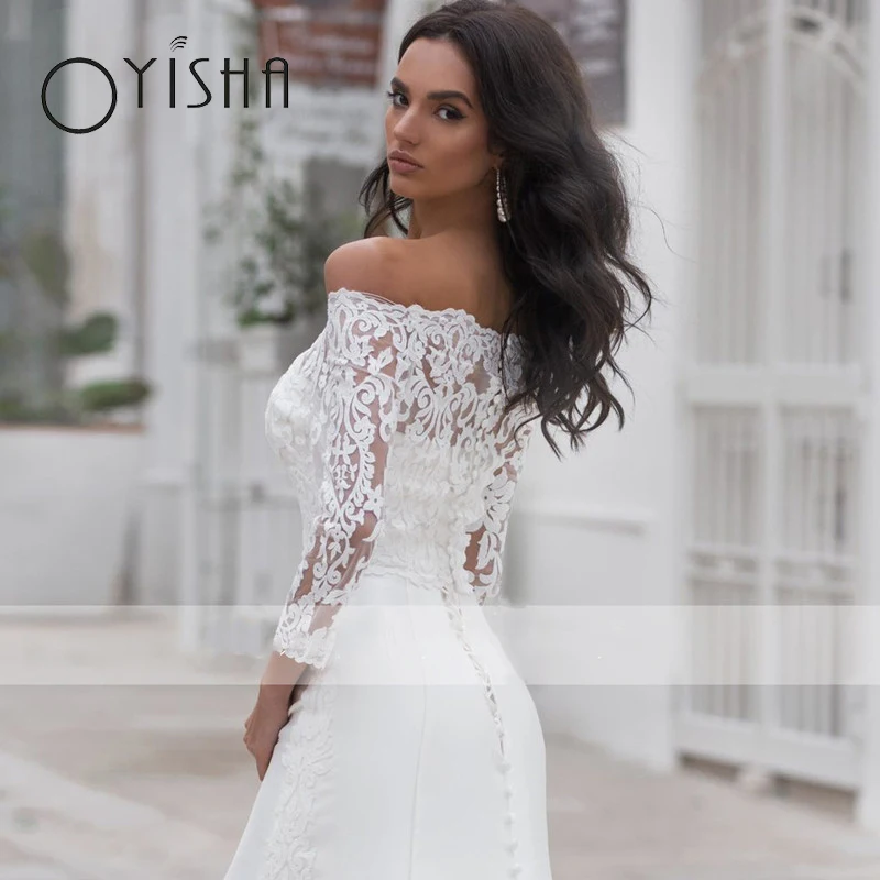 Oyisha Langarm Satin Brautkleider Boot Hals Applikationen Spitze Prinzessin Brautkleid zurück Knöpfe fegen Meerjungfrau Robe de Mariée