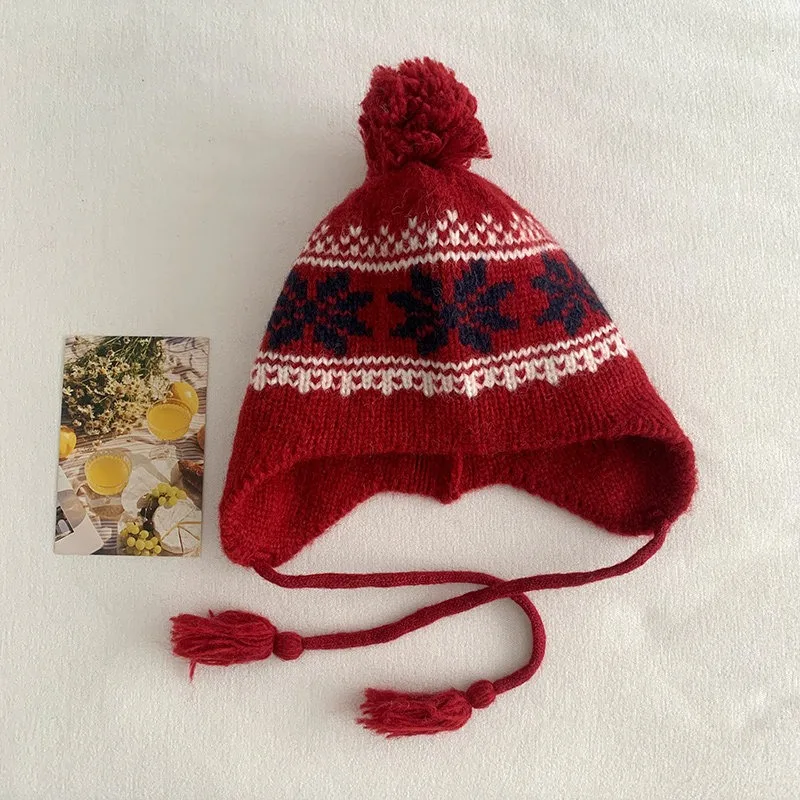 Japanische Retro Fair-Isle-Stil Jacquard-Mütze mit Pelzbällen, warme Ohrenschutz-Bombermütze mit Schnürung für Damen für Herbst und Winter – Detail 8