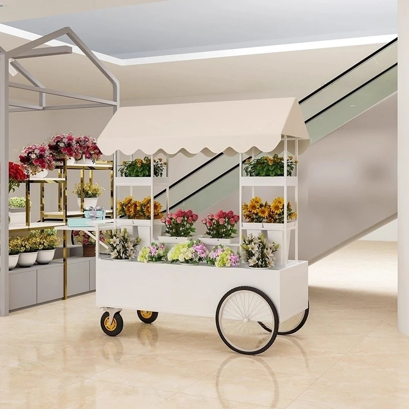 Setting up a stall to sell floats, pushing by hand to display floral art, storage, stall display rack