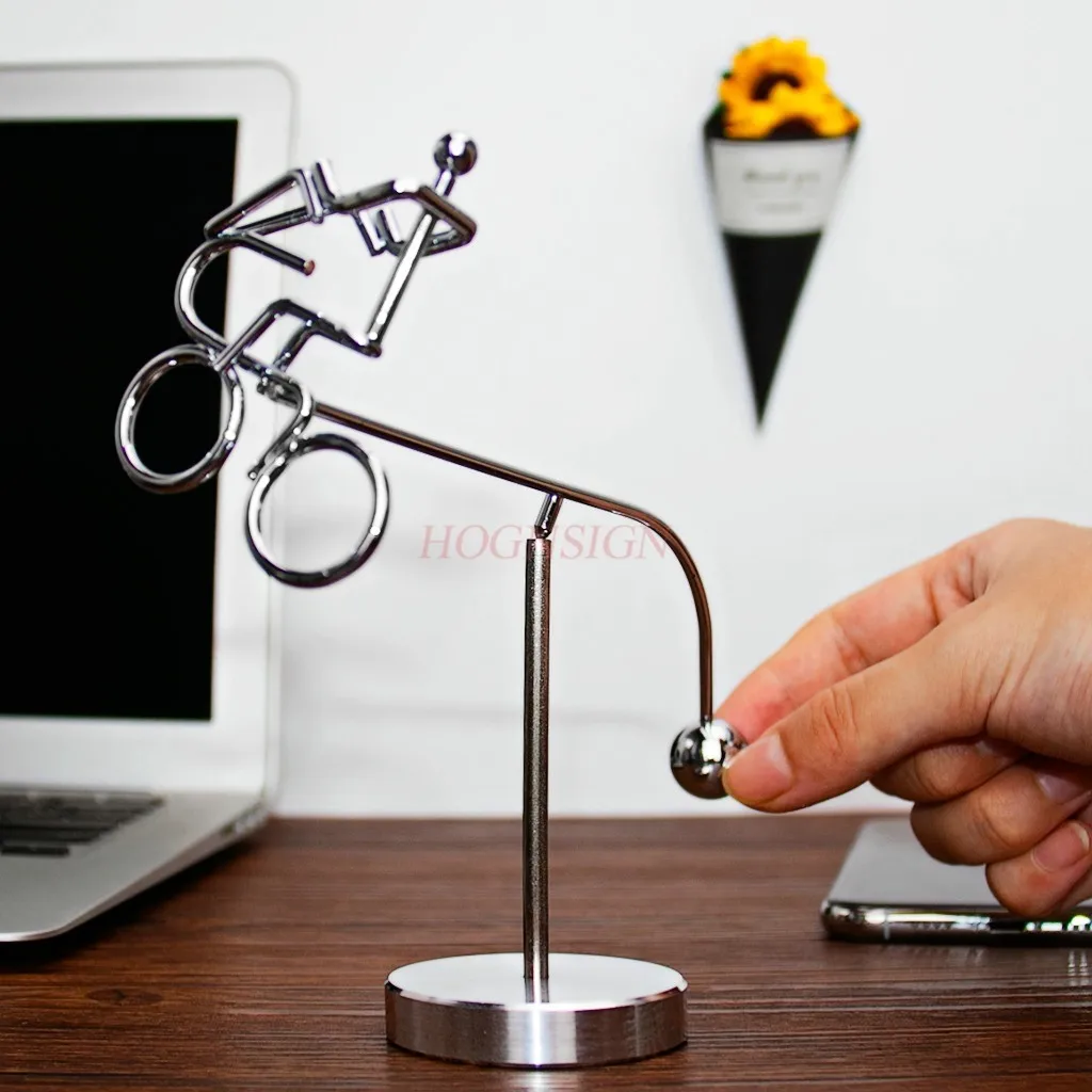 

Dynamic balance, person swinging ball, desktop swinging left and right, physical shaking, rotating pendulum