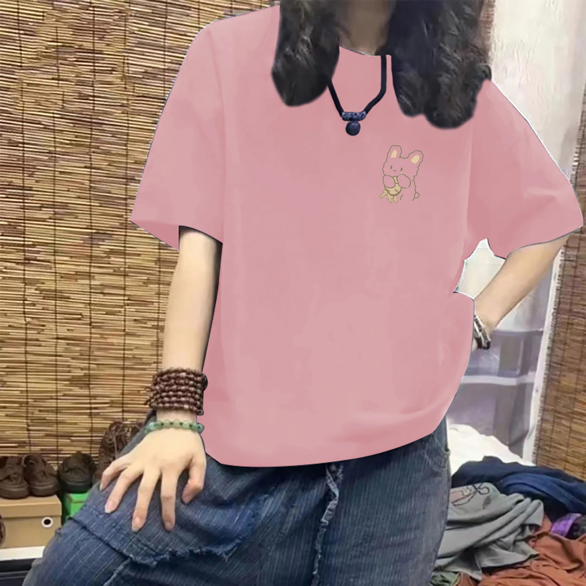 Pink [rabbit holding radish on chest]