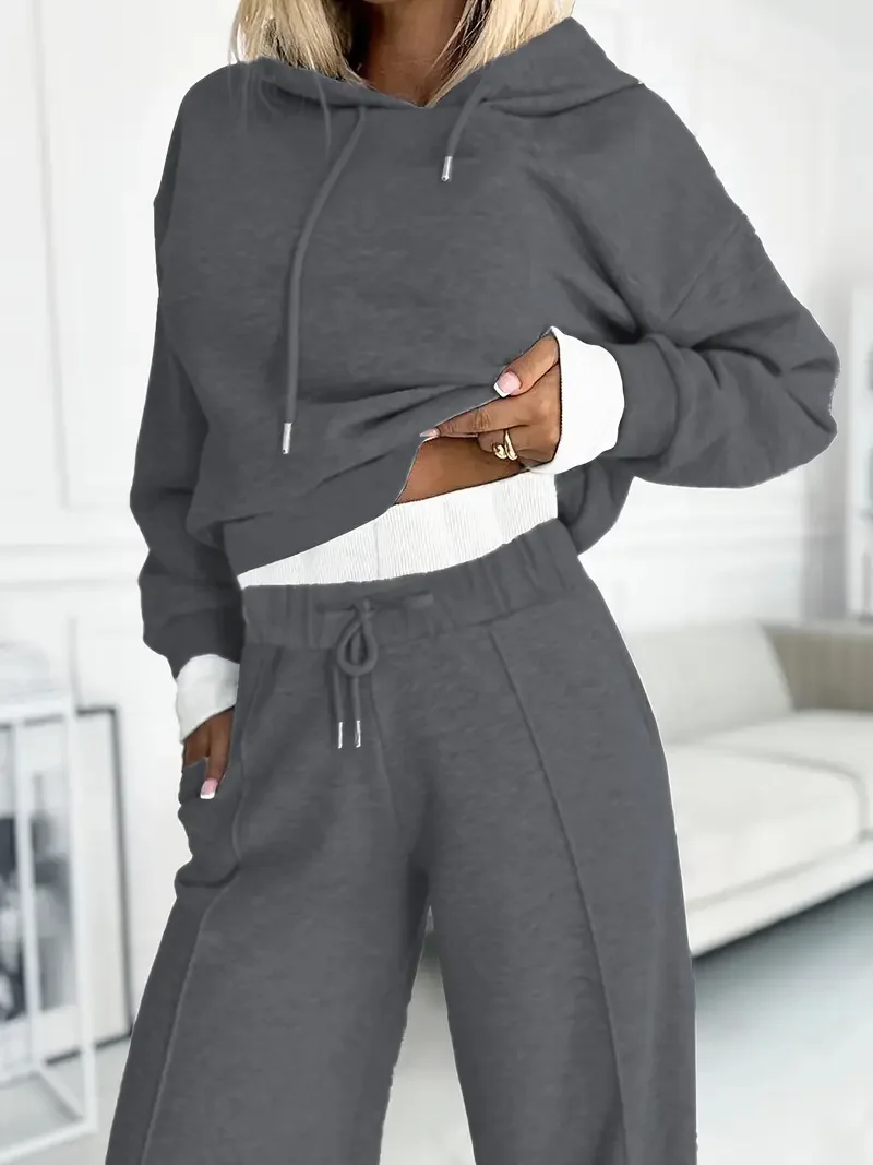 ชุดกีฬาแบบมีฮู้ดสำหรับฤดูใบไม้ร่วงและฤดูหนาวปี 2025 เสื้อแขนยาวสีพื้นแฟชั่นลำลอง กางเกงขายาวทรงกว้าง ชุดสองชิ้น