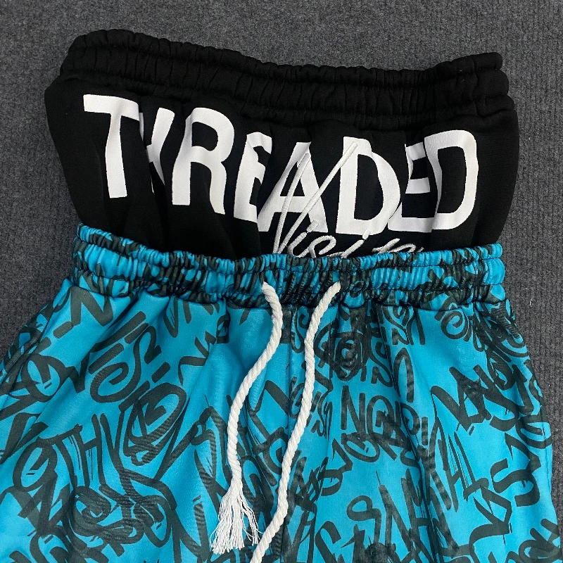 Los Pantalones anchos de doble cintura están de moda, vanguardistas, superpersonalizados y falsos de dos piezas con patrón fluorescente