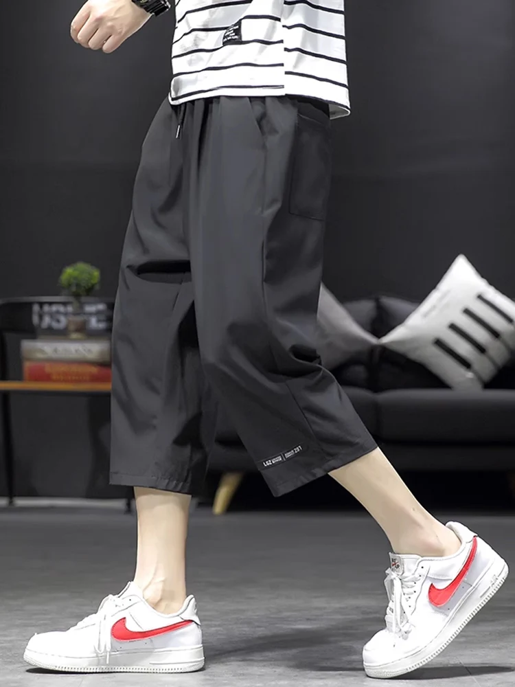 

Мужские летние тонкие повседневные брюки из ледяного шелка, быстросохнущие, укороченные (7/8), свободного кроя, больших размеров, с широкими штанинами, спортивные брюки, модный тренд