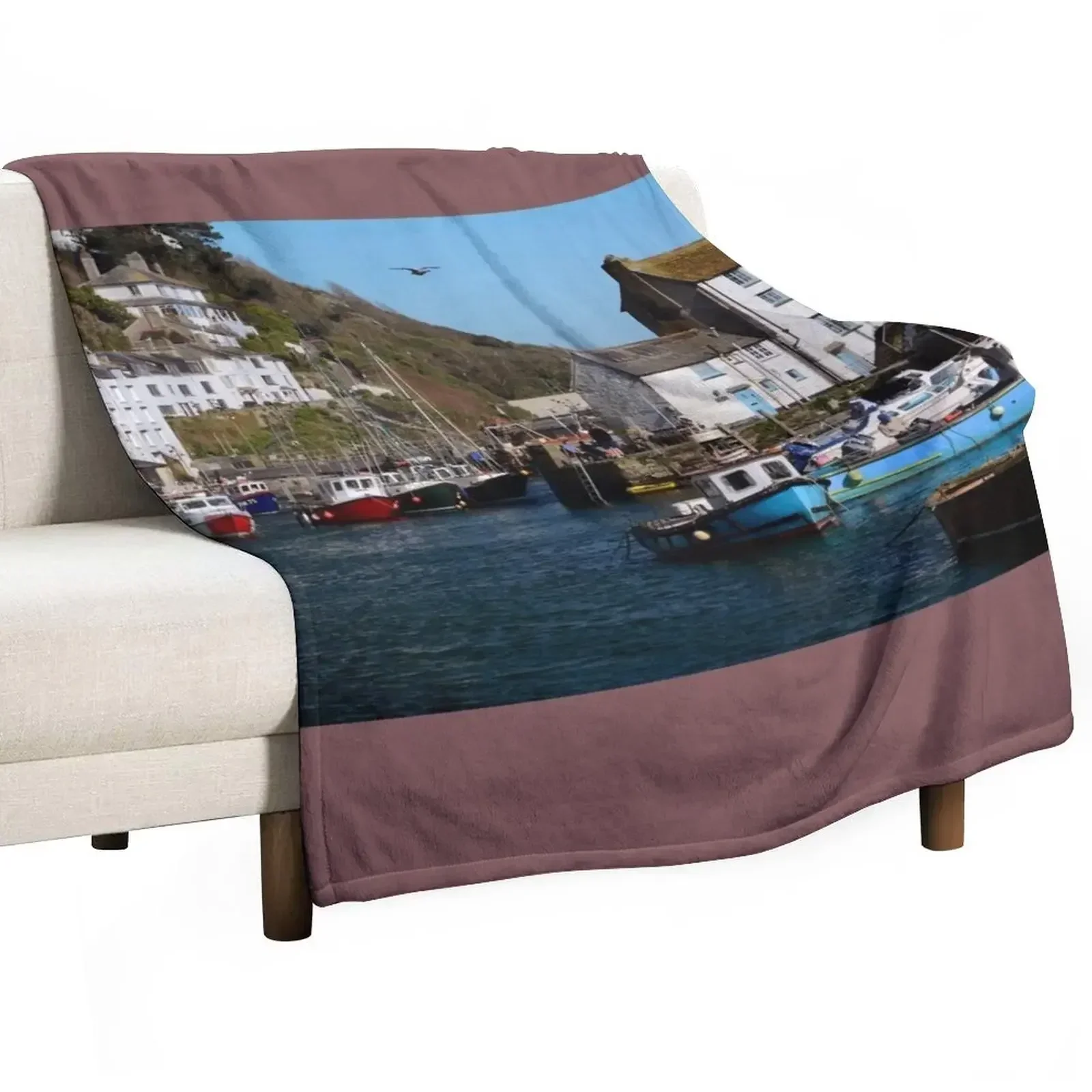 POLPERRO, CORNWALL. APRIL 2017. Throw Blanket Warm blankets and throws blankets ands Retros Plaid on the sofa Stuffeds Blankets